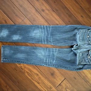 These great distressed jeans are blue with lots of great trim on the rear, cute!